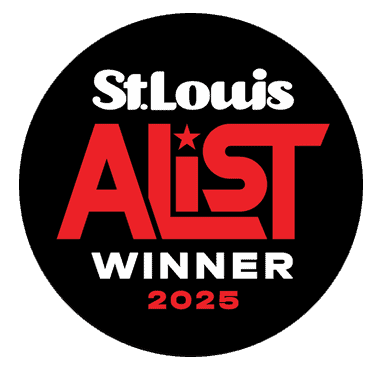 A black circular badge with the text "St. Louis A-List Winner 2025" in white and red letters, with a star incorporated in the letter "I" of "A-List.